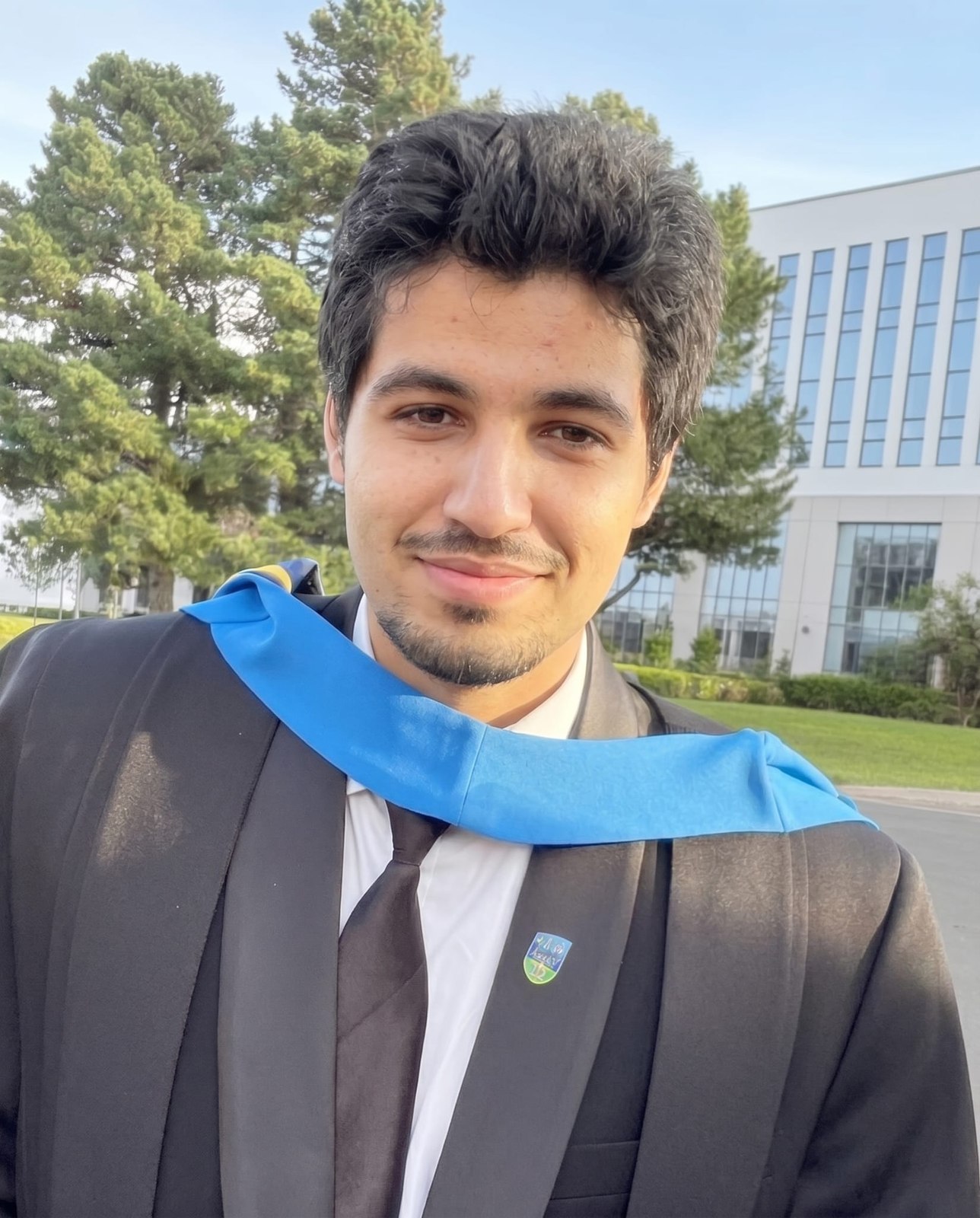 Graduation day at UCD, wearing cap and gown