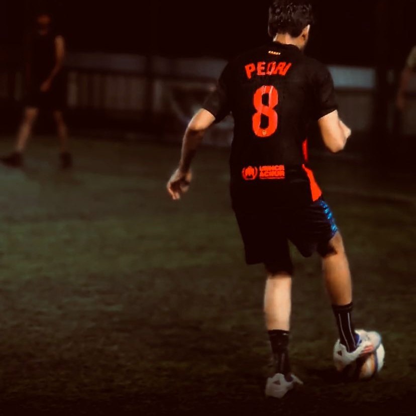 Playing football, back view, jersey number 8